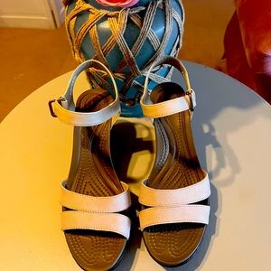 Cream colored wedge heels by Crocs